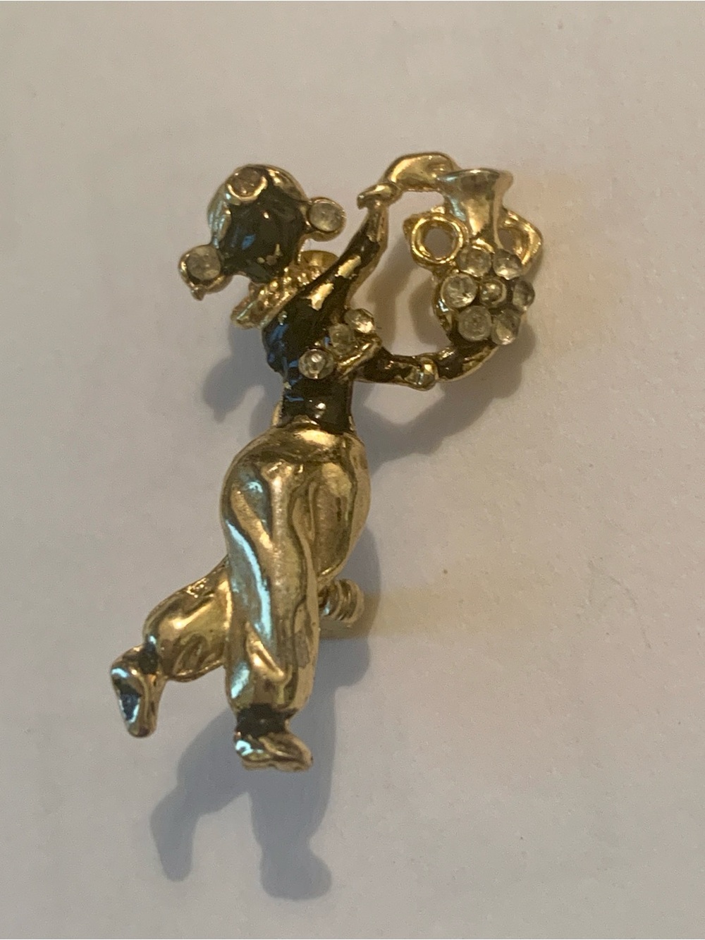 Gold-tone Dancing Figural Brooch with Rhinestone Bouquet